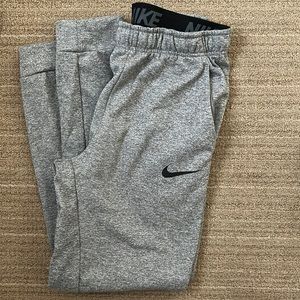 Nike Therma Fit Sweatpants in gray fleck with front pockets and cuff, size M